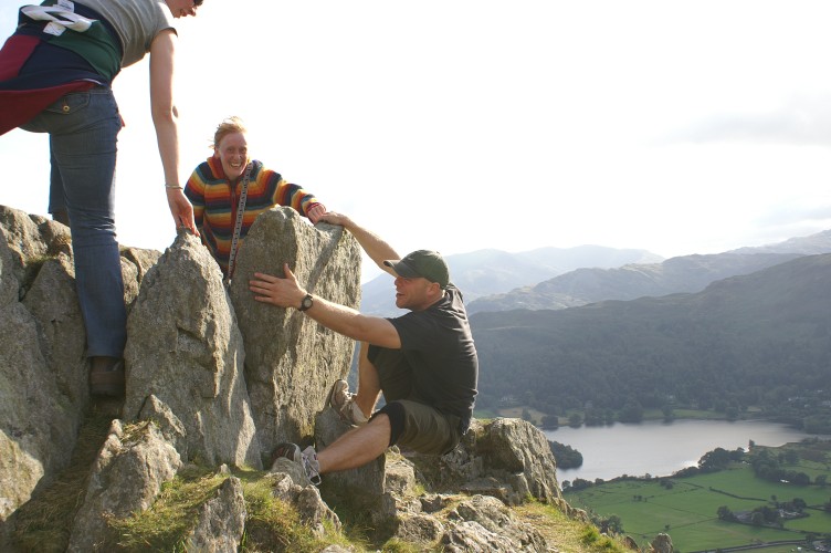 Rick was pretending to climb the rock. Bryony was peeling his hands off the handholds.